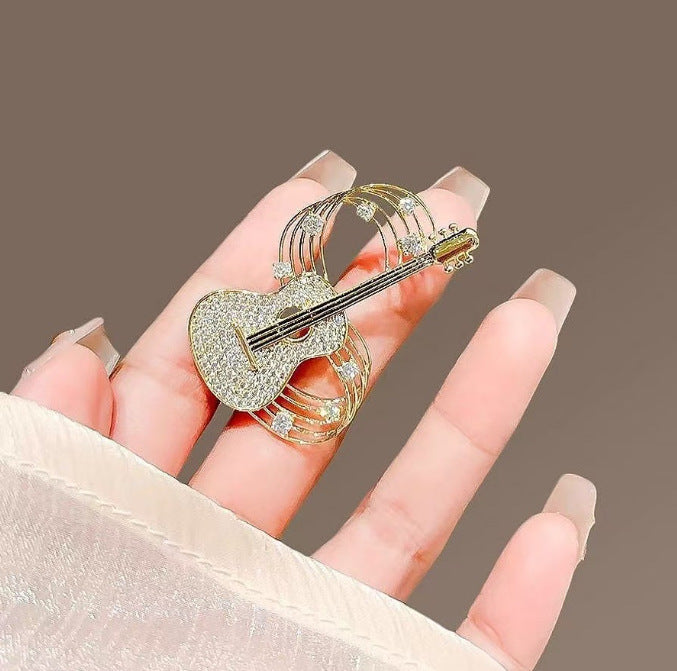 XSB178 - Golden Guitar Saree Brooch